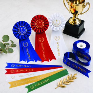 Custom award and presentation ribbons with championship rosettes, prize ribbons and personalised award ribbons for schools, sporting clubs and competitions.